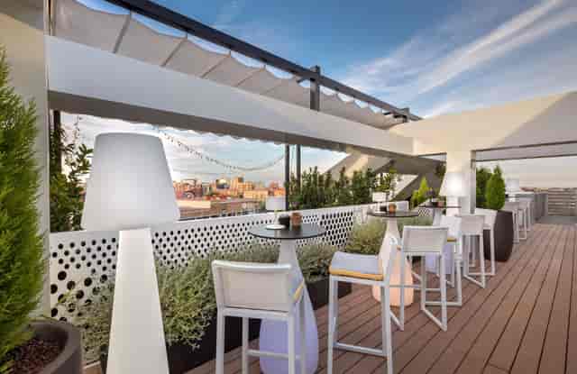 Barceló Imagine rooftop terrace with high-top seating for corporate networking receptions.