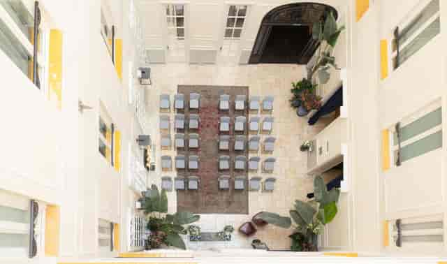 Bodas Urbanas courtyard wedding ceremony at Only YOU Boutique Hotel Madrid with theater seating.