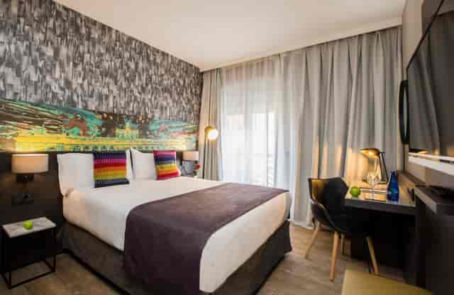 Modern hotel room with ergonomic desk for business travel and boutique event accommodation.