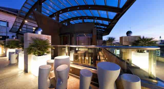 Modern rooftop lounge with mood lighting, ideal for VIP networking and cocktail reception events.