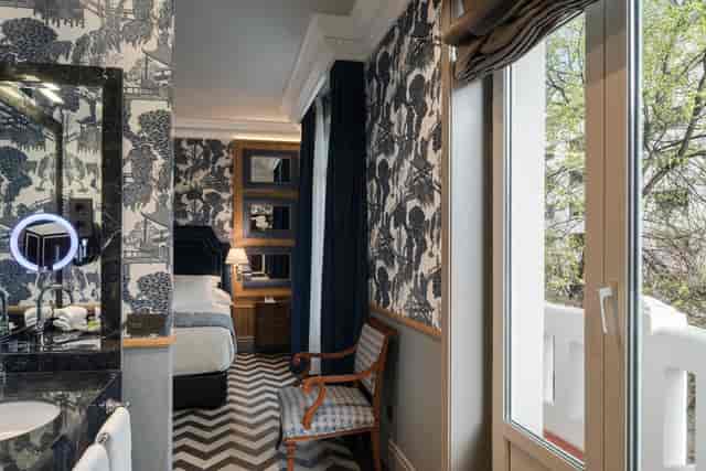 Luxury hotel room with private balcony, ideal for VIP accommodations and executive travel.