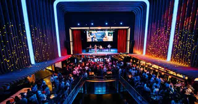 Platea Madrid Booth II: Multi-level corporate reception venue with built-in stage.