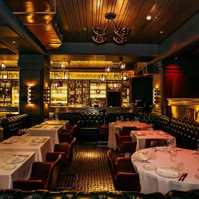 Tatel restaurant bar with elegant banquet seating for corporate dinners and VIP receptions.