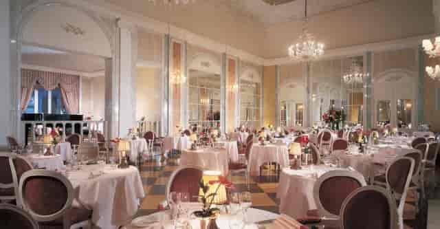 Reid’s Palace ballroom with crystal chandeliers for luxury corporate events and elegant weddings.