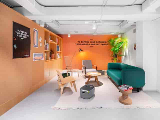 Cozy lounge breakout space for corporate networking and event planning.
