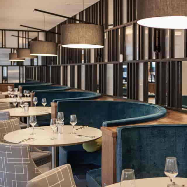 Hawthorns Restaurant, plush velvet banquettes: VIP networking and upscale corporate event space.