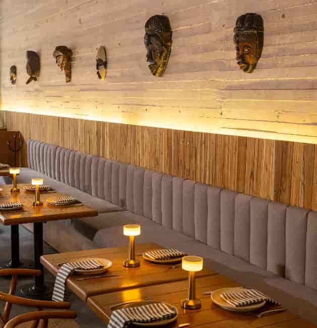 Sophisticated ZUZU Restaurant private dining and networking event space with banquette seating.