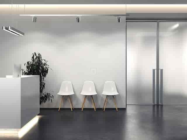 Minimalist registration area at Spaces Turati for professional brand activations and events.