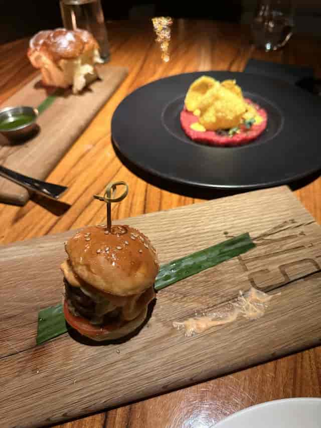 STK Milan Personality Suite catering: rustic wood-plank display for networking reception.