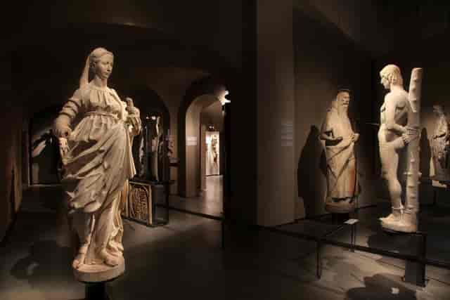 Historic Duomo Museum architecture with atmospheric lighting for exclusive evening receptions.