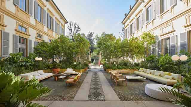 Luxury outdoor courtyard lounge at Palazzo Bovara for corporate events and networking mixers.