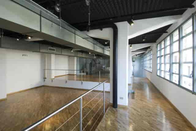 Industrial-chic Magna Pars event space with split-level layout for modern corporate events.