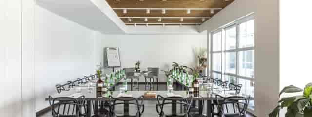 Ambrosia Hall boardroom with U-shape setup for luxury executive meetings and workshops.