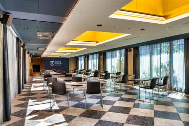 Corporate meeting room with floor-to-ceiling windows at Milano Verticale for business events.