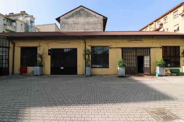 Industrial-chic event space at Officine De Rolandi for creative workshops and brand activations.