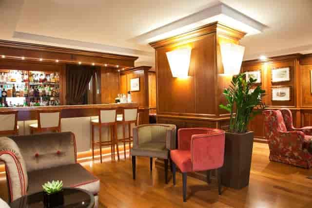 Upscale lounge at Sina De La Ville for intimate networking reception and corporate event hosting.