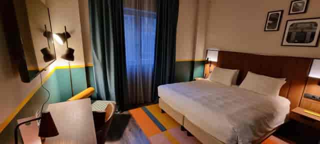 Modern hotel room at Duo Milano Porta Nuova for business conference attendees and event lodging.