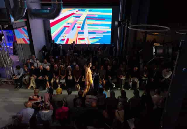 Accademia Costume & Moda industrial fashion runway with LED backdrop for event presentations.