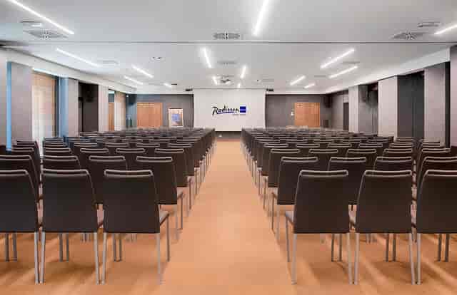 Theater-style conference room at Napoleon Hotel for professional seminars and presentations.