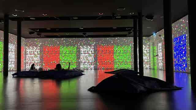 Meeting Room 3 with immersive projection and beanbag seating for creative breakout sessions.