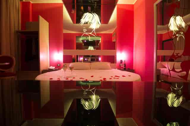 Boutique hotel room at Sempione 320 with romantic rose decor for experiential or VIP travel.