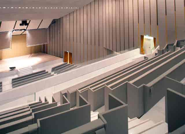 Modern tiered auditorium in Aula Magna for professional keynotes and academic lectures.