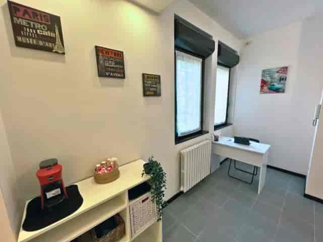 Nina Room private office with coffee station for productive meetings and deep-work sessions.