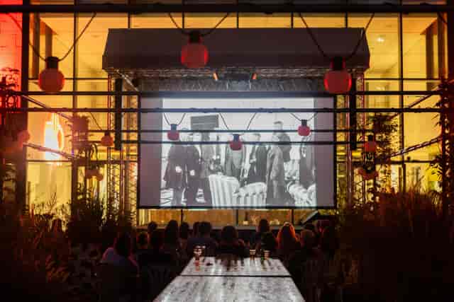 Garden at BiM Milano with string lighting for an atmospheric outdoor event venue and screening.