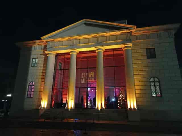 High-end Milan cocktail bar, neoclassical architecture, evening event venue.