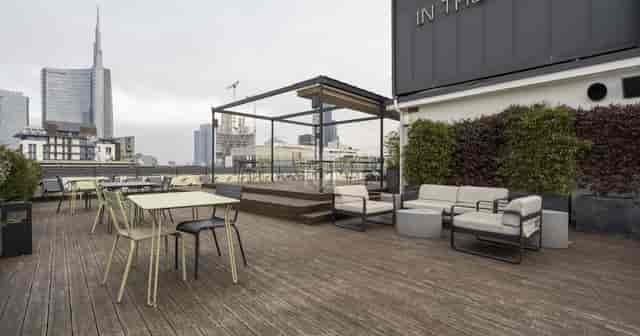 Rooftop meeting room with city skyline view for networking events and corporate presentations.