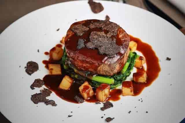 High-end plated entrée at PYT Milano for VIP gala dinner and executive event catering.