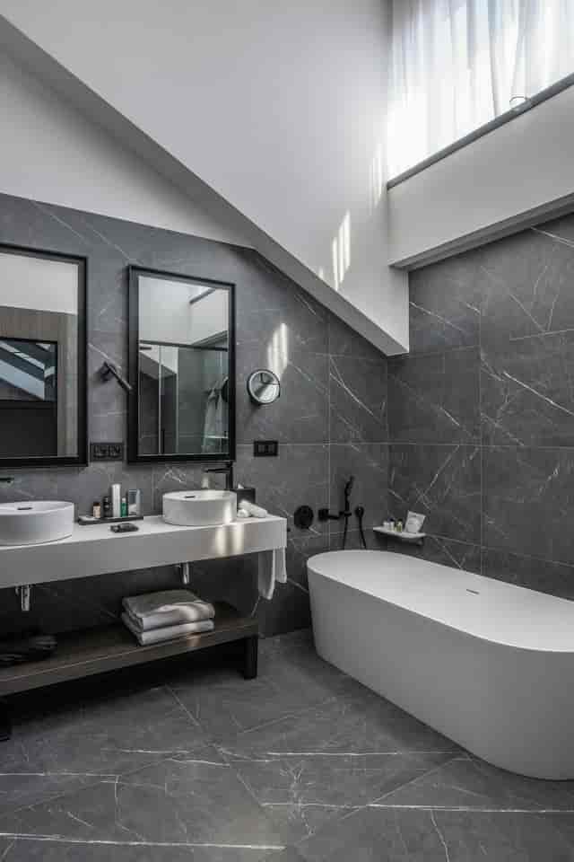 Contemporary Radisson Collection hotel bathroom for luxury event room blocks and incentive travel.