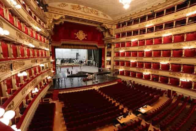 Teatro alla Scala historic auditorium with tiered boxes for prestigious gala and keynote events.