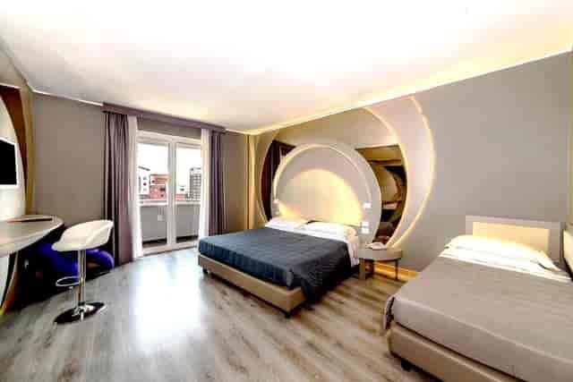 Monet Cezanne triple room with workstation and balcony for corporate travel and business events.