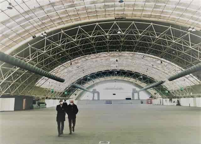 Industrial event space, Padiglione D, high-ceiling venue, trade show, conference hall.