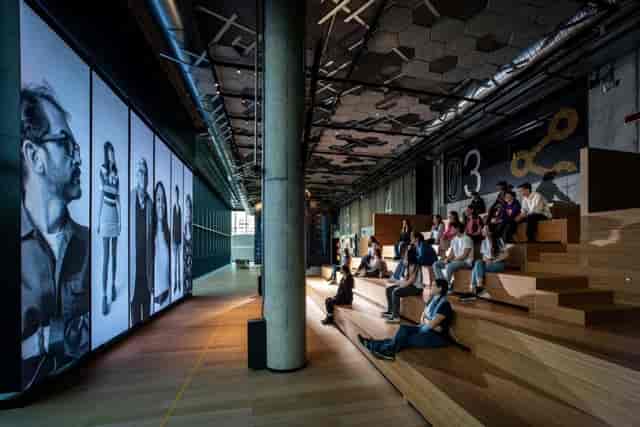 STEP FuturAbility District flexible breakout space with tiered wooden seating for workshops.