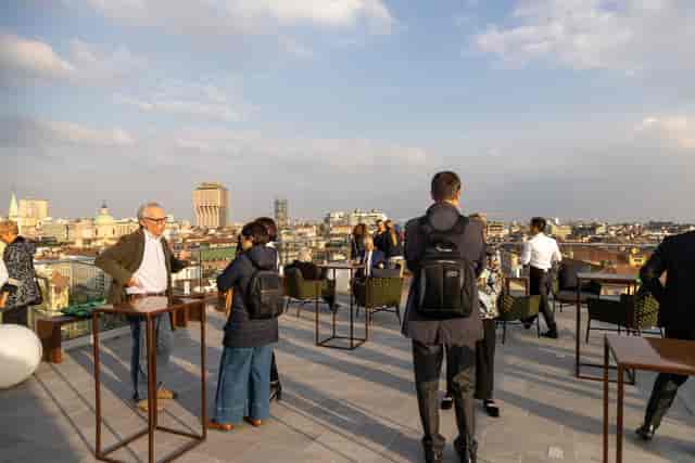 Hotel Ariston rooftop terrace networking reception with high-top tables for corporate events.