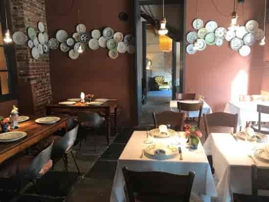 Hotel Maison Borella suite with textured walls for high-end boutique dining and private events.