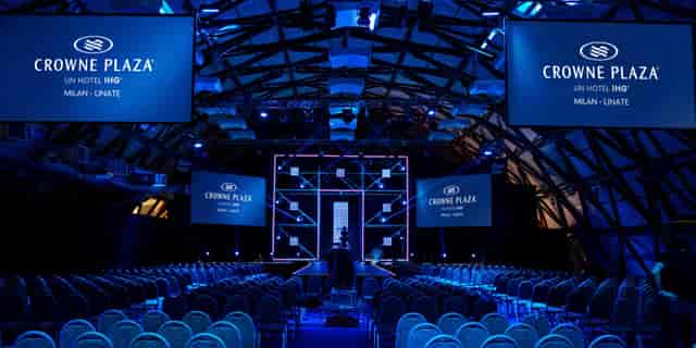 Theater-style conference center with truss rig for Milan business events and corporate meetings.
