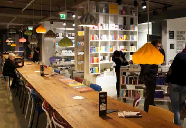 Bookstore in Open Milano: creative workshop breakout space for small group event discussions.