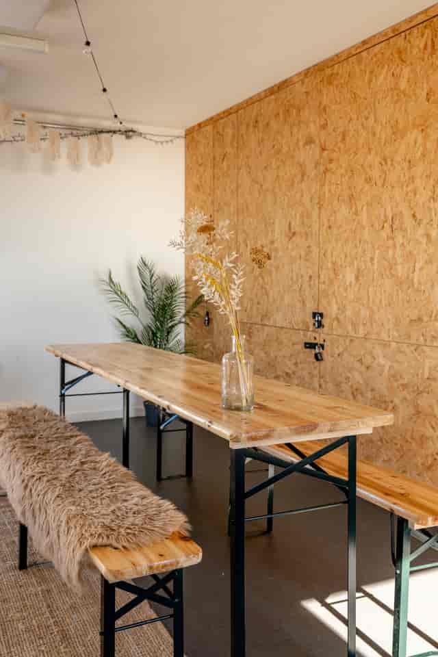 Industrial-chic breakout space with rustic biergarten table at The Studio, Brighton. Workshop venue.