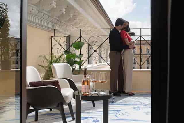 Luxury hotel suite terrace bar in Rome for romantic getaways and premium event bookings.