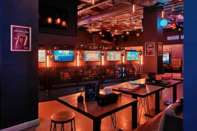 Modern event venue with vibrant lighting for networking and casual gatherings.