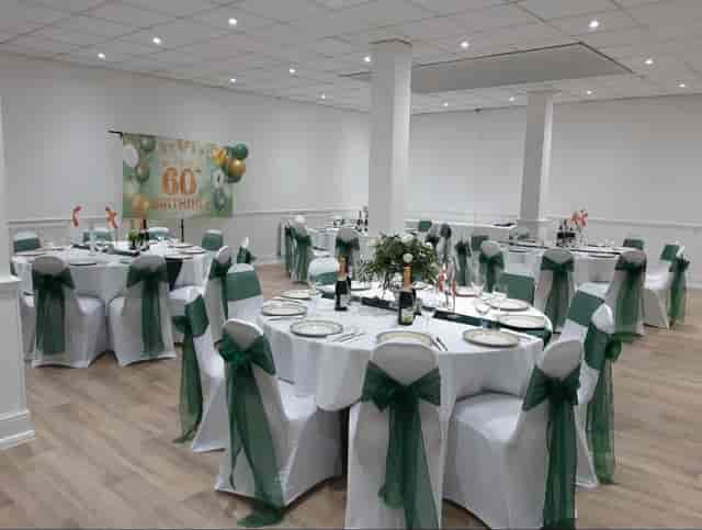 Apollo Suite banquet hall with sage green decor, perfect for milestone events and wedding parties.