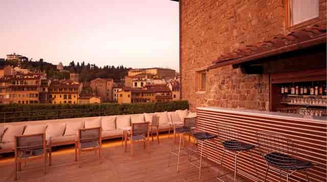 Rooftop bar with historic views, perfect for luxury networking events and cocktail receptions.