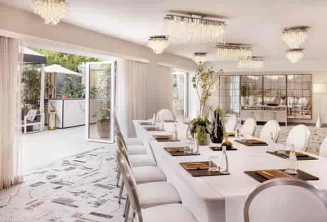 Upscale boardroom at The Huntley Hotel, elegant executive meeting space with natural light.