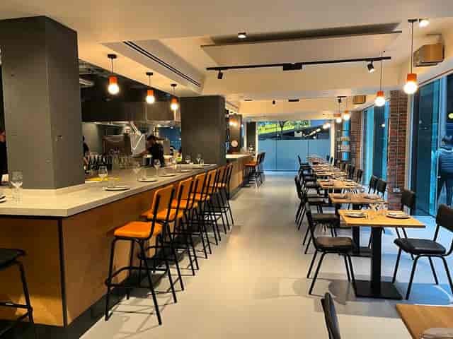 Modern restaurant dining room for corporate events and social mixers.
