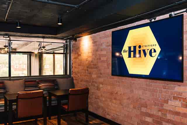 Industrial-chic meeting room at The Hive for collaborative team workshops and client briefings.