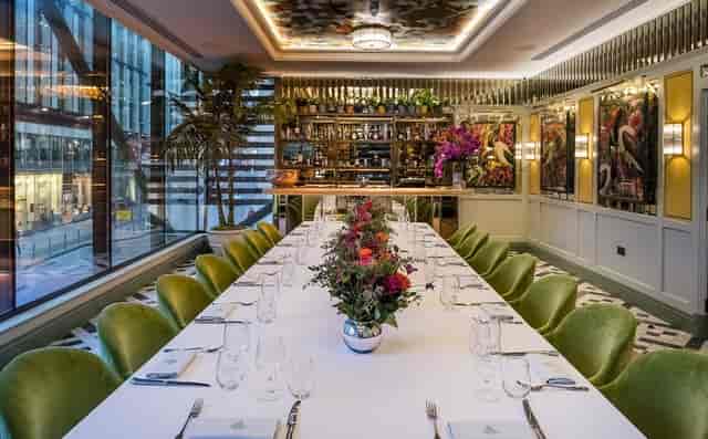 Luxury private dining room with velvet seating for exclusive executive meetings and client dinners.