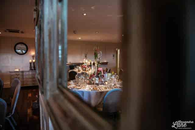 Vintage reception area with sophisticated lighting for high-end events and boutique dinners.